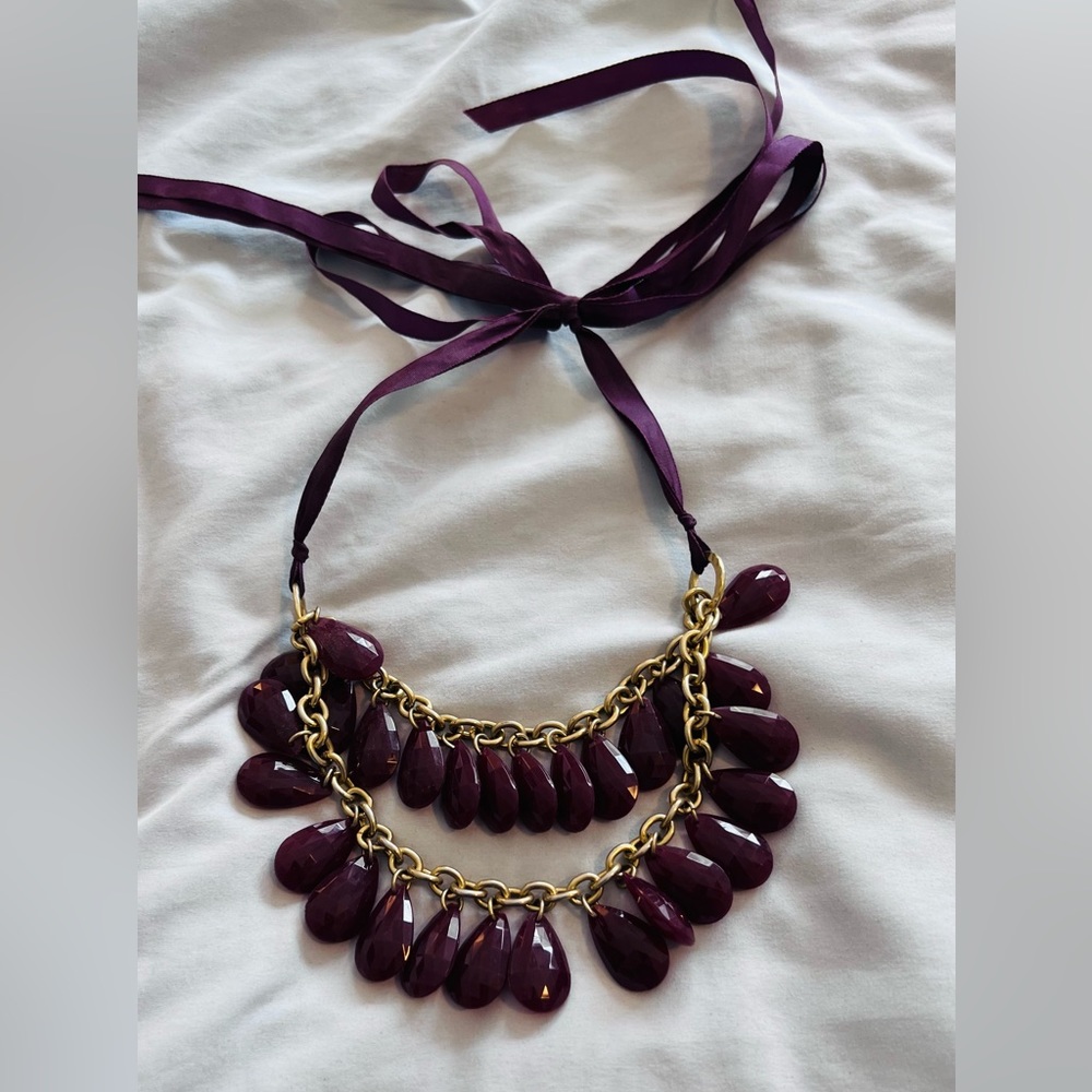 Purple tie neck teardrop jewled tiered necklace with gold accent